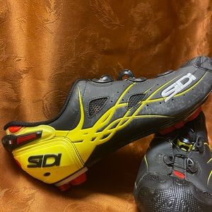 Yellow and red Sidi cycling shoes.
